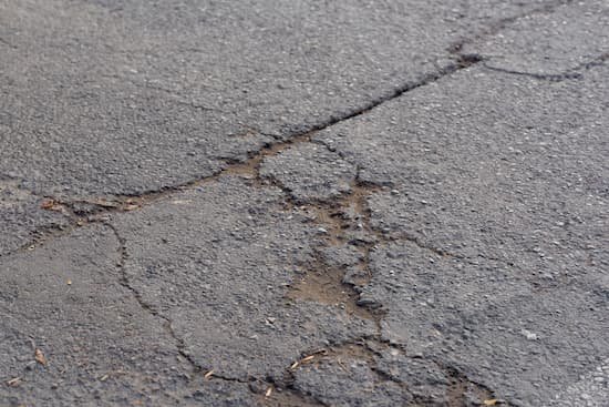 Driveway that needs a asphalt repair company to come repair the crack