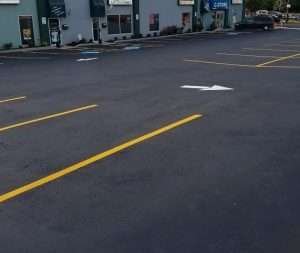 A parking lot with a yellow line on it.