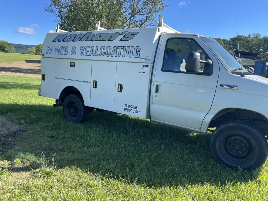 a white truck parked on grass