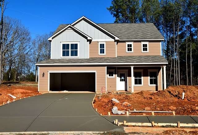 A new driveway installation in Central PA, featuring a pristine asphalt surface.