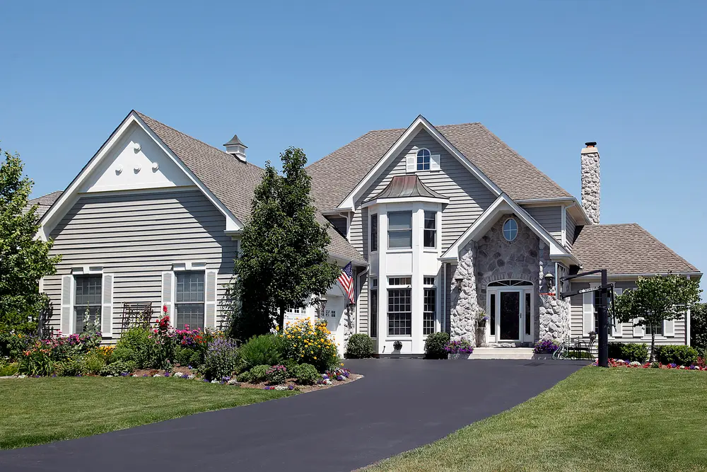 A well-maintained driveway leading to a home.