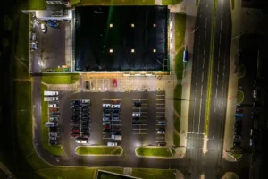 An aerial view of a parking lot at night